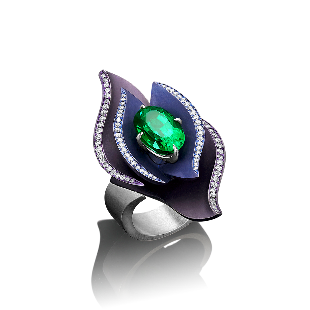 Iris ring by Adam Neeley featuring titanium and platinum with vivid tsavorite garnet and diamond in a sculptural high jewelry design